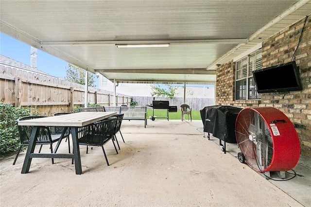 view of patio / terrace with outdoor dining area, fence, and grilling area