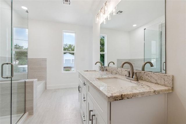 10053 Joel Ave, River Ridge, LA 70123 - bathroom featuring double vanity, visible vents, and a sink