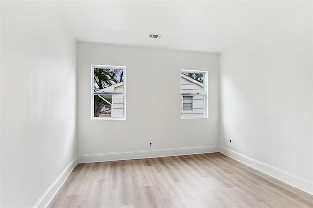10053 Joel Ave, River Ridge, LA 70123 - spare room with baseboards, visible vents, and light wood-style flooring