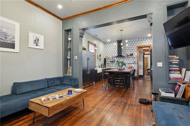 living room featuring dark wood-style floors and ornamental molding