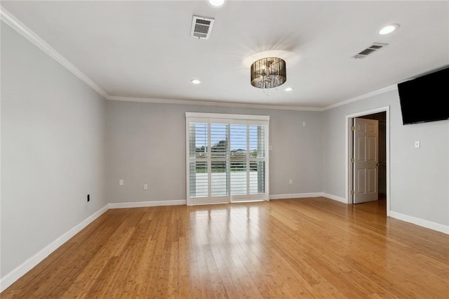 unfurnished room with light wood-style floors, baseboards, and visible vents