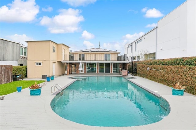 view of swimming pool with a fenced in pool, cooling unit, a patio area, and fence