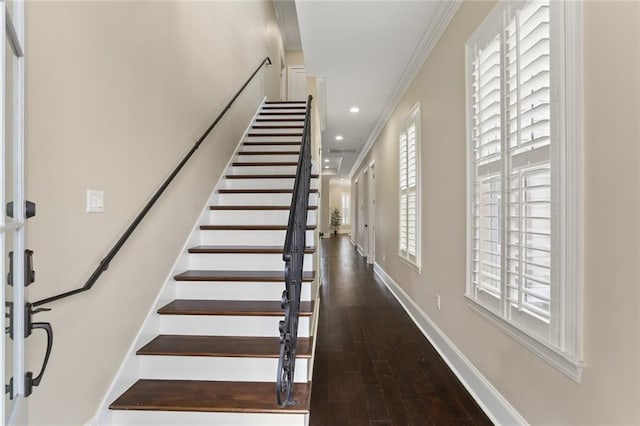 staircase with ornamental molding, recessed lighting, wood finished floors, and baseboards