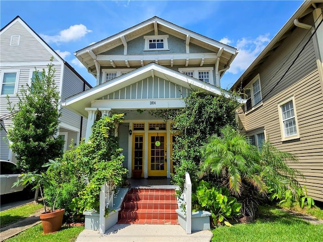 view of exterior entry featuring board and batten siding