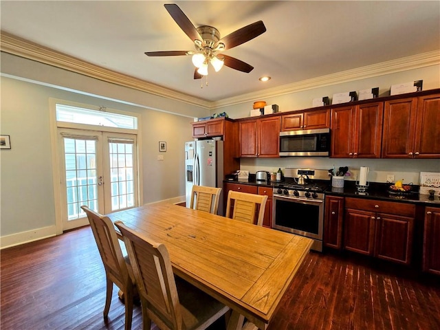 kitchen featuring ornamental molding, french doors, appliances with stainless steel finishes, dark countertops, and dark wood finished floors