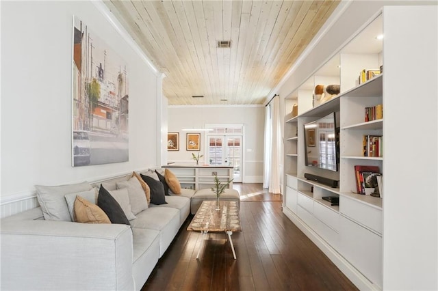 717 Port St, New Orleans, LA 70117 - living room with visible vents, built in shelves, crown molding, wooden ceiling, and dark wood-type flooring