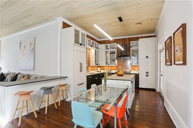 717 Port St, New Orleans, LA 70117 - dining space with wood ceiling, crown molding, and dark wood-style flooring