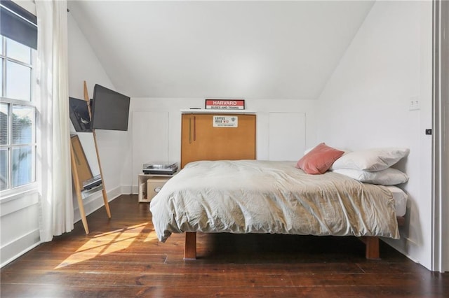 717 Port St, New Orleans, LA 70117 - bedroom with vaulted ceiling and wood finished floors