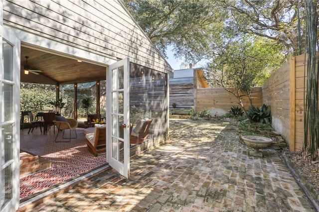 717 Port St, New Orleans, LA 70117 - view of patio featuring a fenced backyard and a ceiling fan