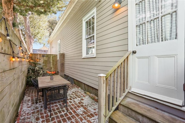 717 Port St, New Orleans, LA 70117 - view of property exterior with a patio area, outdoor dining space, and fence