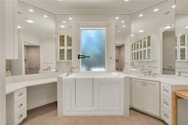 full bathroom with ornamental molding, vanity, a bath, and recessed lighting