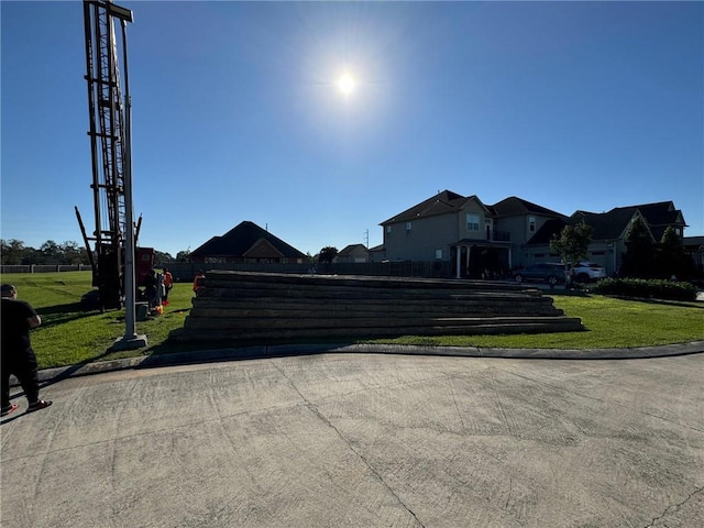 view of road with a residential view and curbs