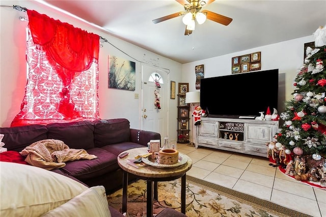 living area featuring tile patterned flooring and a ceiling fan