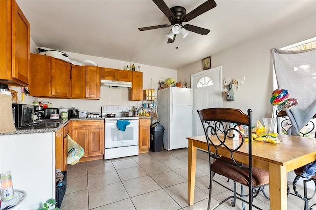 kitchen with light tile patterned floors, brown cabinetry, a ceiling fan, white appliances, and under cabinet range hood