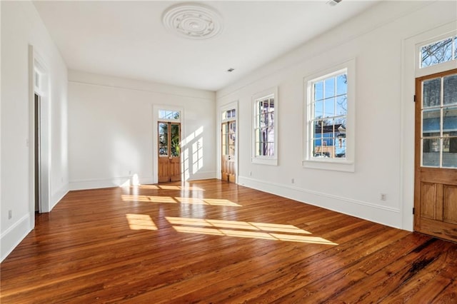 3829 Dauphine St, New Orleans, LA 70117 - interior space with baseboards and wood finished floors