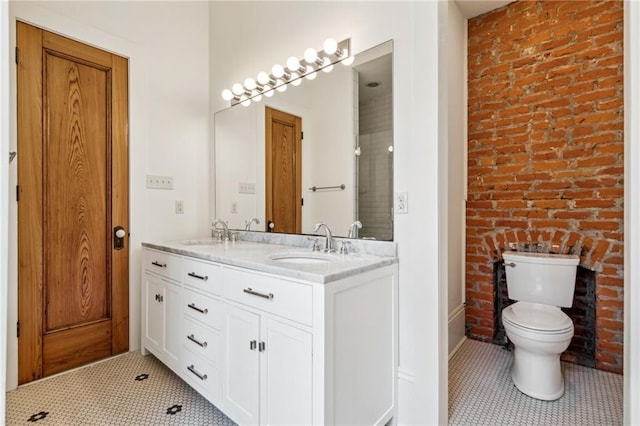 bathroom featuring double vanity, tile patterned flooring, and a sink