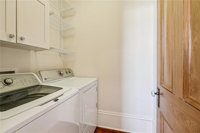 3829 Dauphine St, New Orleans, LA 70117 - laundry area with cabinet space, independent washer and dryer, and baseboards