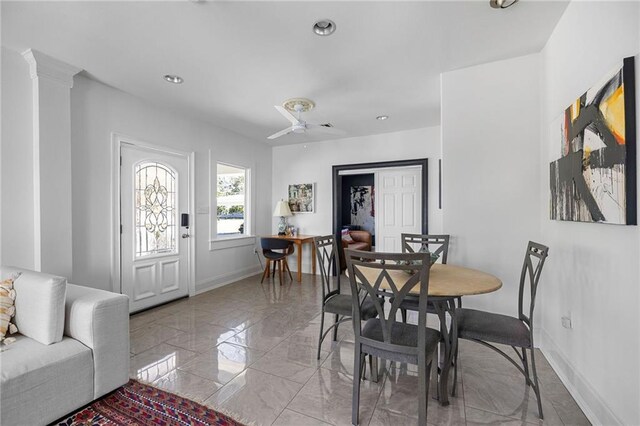 dining area with recessed lighting, marble finish floor, baseboards, and ornate columns