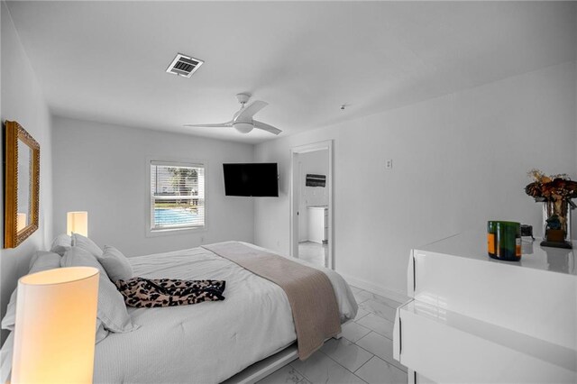 bedroom with marble finish floor, baseboards, visible vents, and ceiling fan