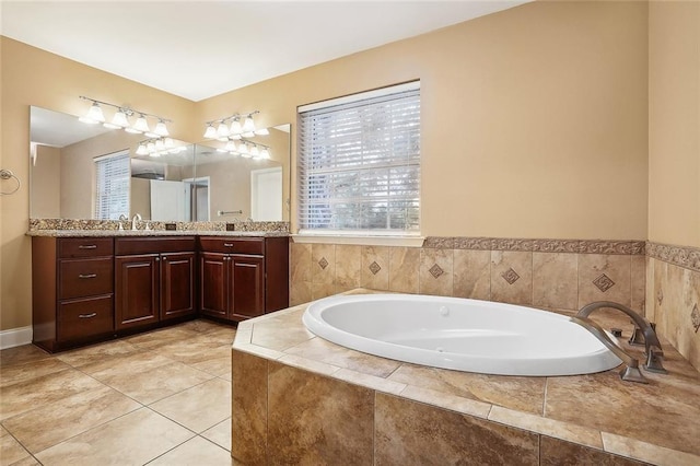 full bathroom with tile patterned floors, a sink, a garden tub, and double vanity