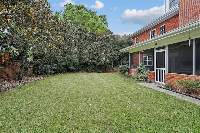 view of yard with a sunroom