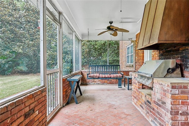 sunroom featuring plenty of natural light and ceiling fan