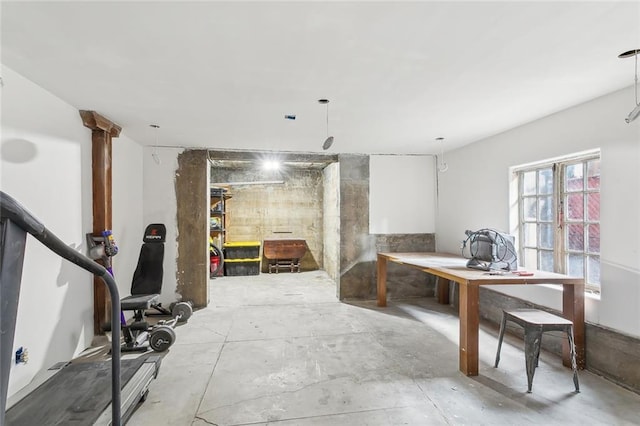 office space with concrete flooring and a workshop area