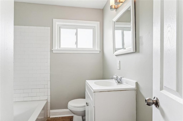 full bath with toilet, baseboards, and vanity