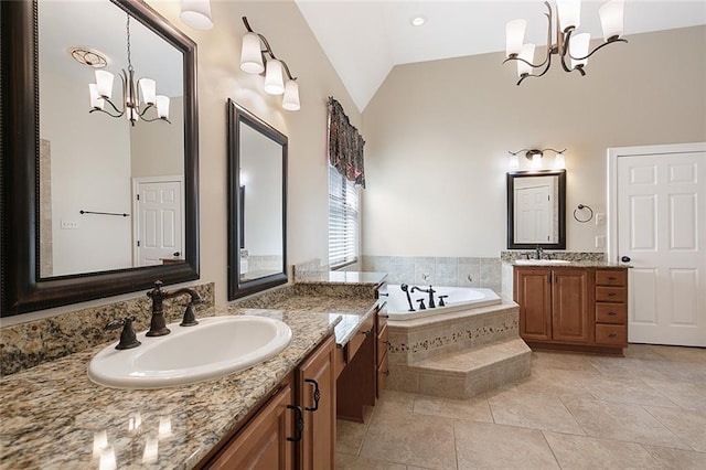 full bathroom with an inviting chandelier, vaulted ceiling, two vanities, and a sink