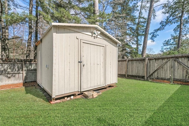 view of shed with a fenced backyard