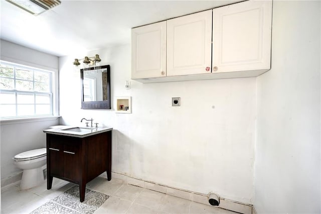 bathroom with toilet and vanity