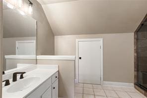 full bathroom featuring tile patterned flooring, vanity, baseboards, vaulted ceiling, and a shower with door