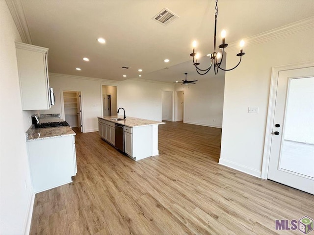 kitchen with a sink, dishwasher, stove, crown molding, and recessed lighting