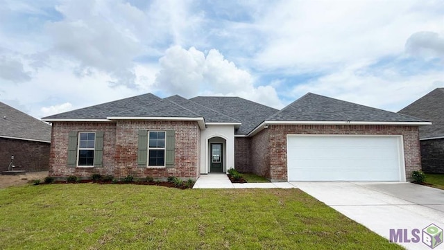 view of front facade with a garage, concrete driveway, roof with shingles, and brick siding