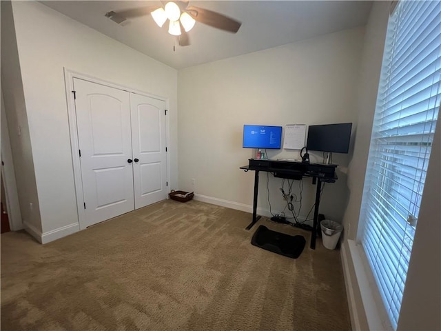 office with carpet, a ceiling fan, and baseboards