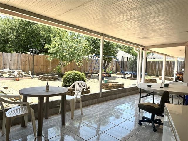 sunroom with wooden ceiling