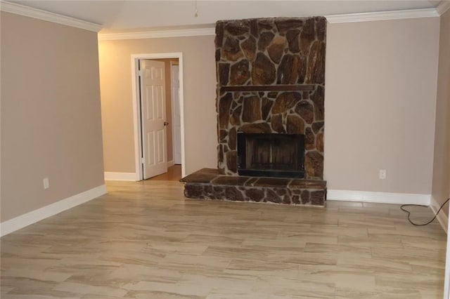 unfurnished living room with ornamental molding, a fireplace, and baseboards