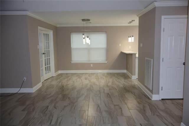 interior space featuring baseboards, visible vents, and ornamental molding