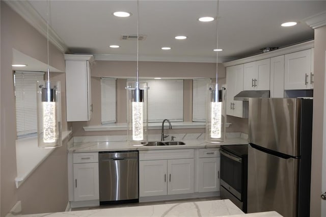 kitchen with under cabinet range hood, a sink, white cabinetry, appliances with stainless steel finishes, and decorative light fixtures