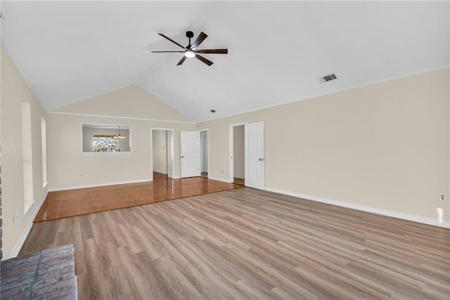 unfurnished living room featuring baseboards, visible vents, a ceiling fan, wood finished floors, and vaulted ceiling