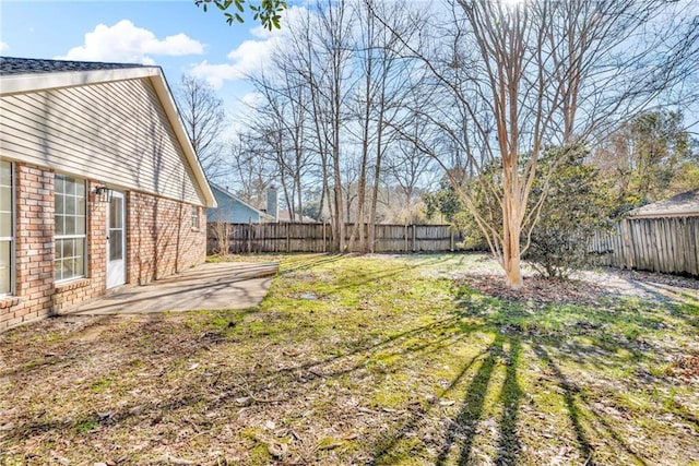 view of yard featuring a patio and a fenced backyard