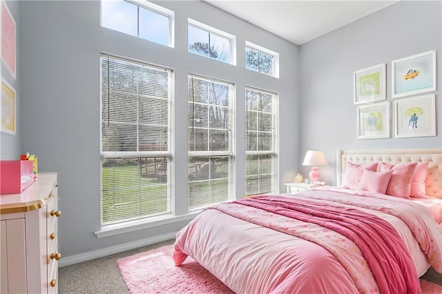 carpeted bedroom with baseboards