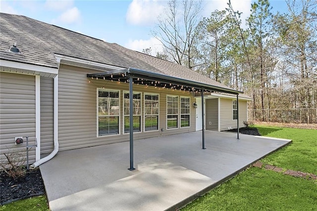 view of patio featuring fence