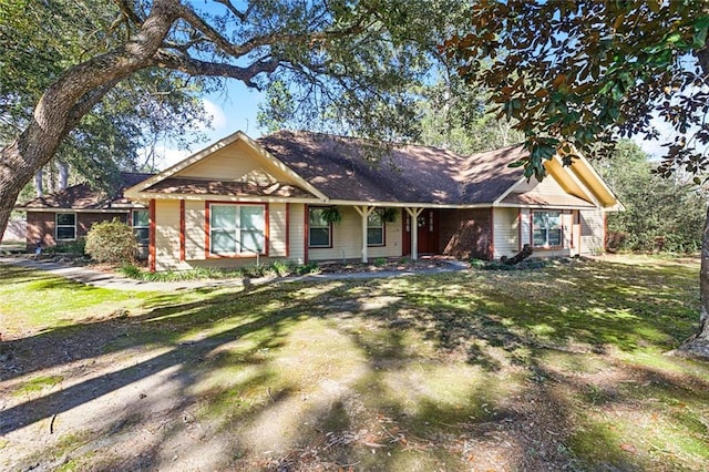 ranch-style home featuring a front yard