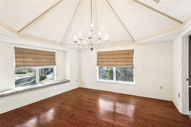 unfurnished room featuring a notable chandelier, vaulted ceiling with beams, baseboards, and wood finished floors