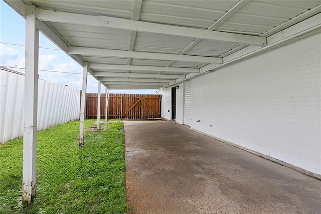 view of parking with fence