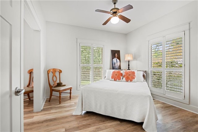 bedroom featuring a ceiling fan and light wood-type flooring