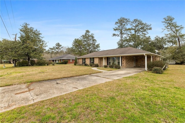 single story home featuring a carport, driveway, a front lawn, and brick siding