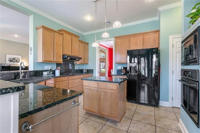 kitchen with visible vents, decorative light fixtures, under cabinet range hood, black appliances, and a sink