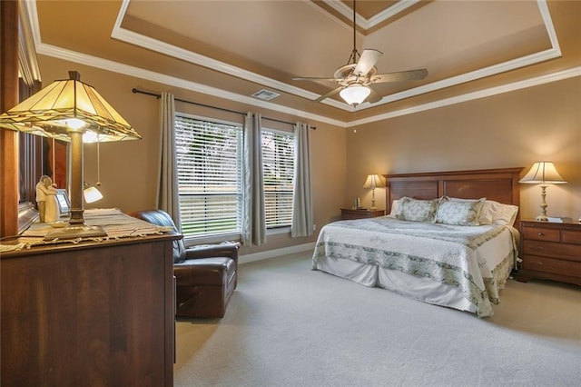 bedroom with light carpet, visible vents, a raised ceiling, ceiling fan, and crown molding